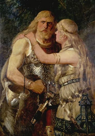 A male viking, wearing armor and weapons, stands assertively and looks into the distance while a female viking holds him around the neck and looks up at him